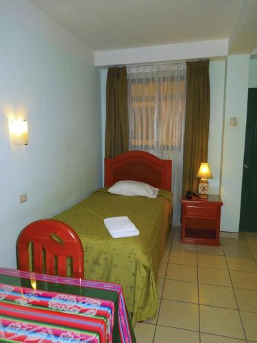 Postel nebo postele na pokoji v ubytování Libon's Hotel