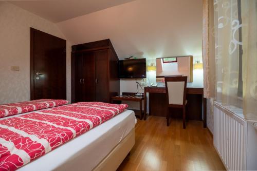 Ένα ή περισσότερα κρεβάτια σε δωμάτιο στο Vila Silva Marija Apartments