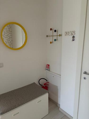 a white bathroom with a mirror and a counter at Casita Stella, vicino Ospedale Negrar, Valpolicella in Negrar