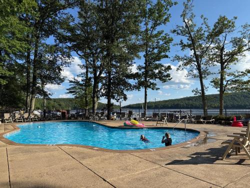 two people in a swimming pool in a park at Hope's Hideaway in Blakeslee