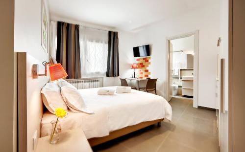 Ένα ή περισσότερα κρεβάτια σε δωμάτιο στο Residence Dei Viali