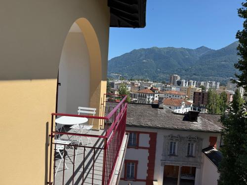 a surfboard on the side of a building with a balcony at Schloss Locarno - Self Check-In in Locarno