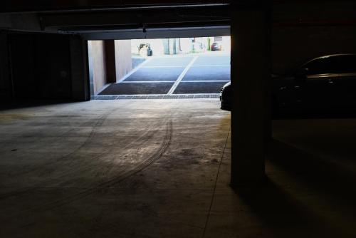 a dark room with a hallway with a street at Beach Vibe Hotel Mamaia Nord in Mamaia Nord