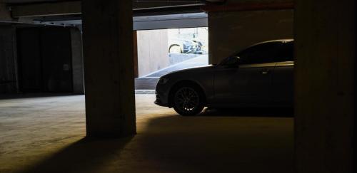 a car parked inside of a parking garage at Beach Vibe Hotel Mamaia Nord in Mamaia Nord