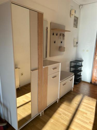 a room with a closet with a mirror and a dresser at Apartments Stećak in Sarajevo