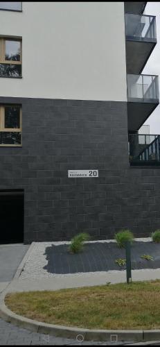 a building with a sign on the side of it at Apartament Zielone Wzgórze 3 in Jelenia Góra