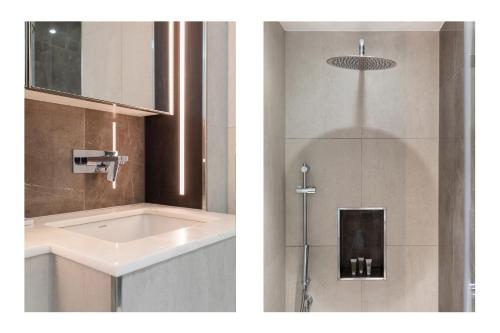un baño con lavabo y ducha en Luxury 2BR Old Street, en Londres