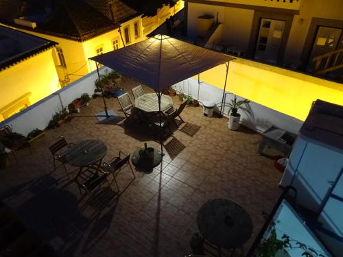 an overhead view of an outdoor patio at night at Lagoas in Tavira