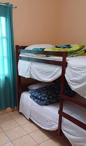 a room with two bunk beds and a window at Villas del Edén in El Pino
