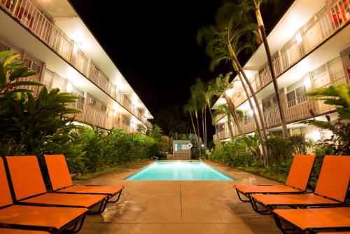 a swimming pool in the middle of a building at night at Pacific Marina Inn Airport in Honolulu