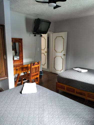 Ένα ή περισσότερα κρεβάτια σε δωμάτιο στο Hotel Bungalows La Era