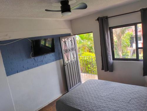 Ένα ή περισσότερα κρεβάτια σε δωμάτιο στο Hotel Bungalows La Era
