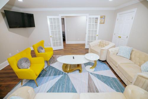 a living room with a couch and chairs and a table at Beautiful Estate in 19 acres of land in Apex in Apex
