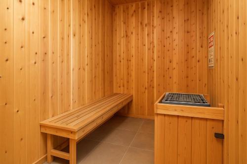 a sauna with a wooden bench and a platform at New Cozy 1BR Apt with Gym Sauna & Heated Pool Access in Reno