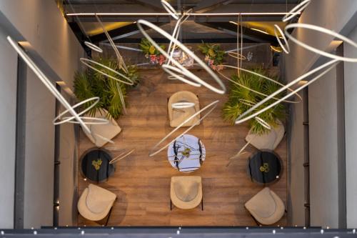 an overhead view of a restaurant with tables and chairs at MX Grand Suites in Mexico City
