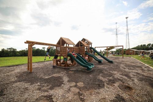 a park with a playground with a slide at Block of 7 Lodges at Eden Reserve - For Groups in Williamstown