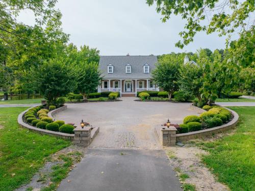 a large driveway in front of a large house at Beautiful Estate in 19 acres of land in Apex in Apex