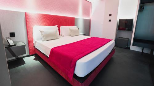 Ένα ή περισσότερα κρεβάτια σε δωμάτιο στο Oro Private Hotel