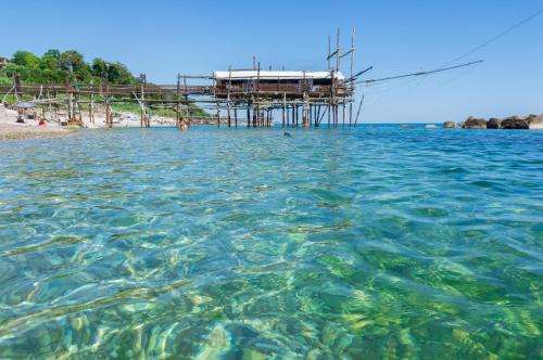 a view of the water with a pier in the background at Costa Trabocchi appartamento sul Mare in Fossacesia