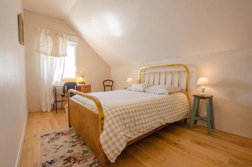 Postel nebo postele na pokoji v ubytování Les ancetres