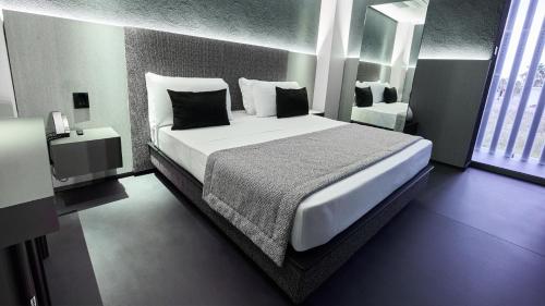 Ένα ή περισσότερα κρεβάτια σε δωμάτιο στο Oro Private Hotel