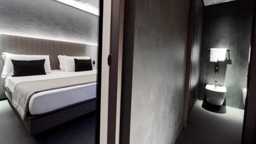 Ένα ή περισσότερα κρεβάτια σε δωμάτιο στο Oro Private Hotel