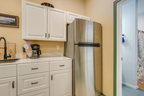 a kitchen with white cabinets and a stainless steel refrigerator at Less Than half Mi to OSU Studio in Corvallis Near Parks in Corvallis