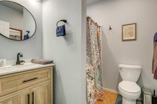 a bathroom with a toilet and a sink and a mirror at Less Than half Mi to OSU Studio in Corvallis Near Parks in Corvallis
