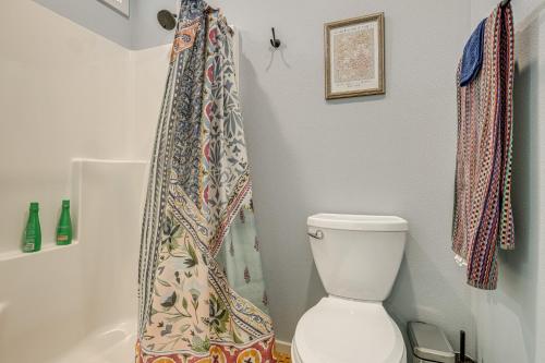 a bathroom with a toilet and a shower curtain at Less Than half Mi to OSU Studio in Corvallis Near Parks in Corvallis