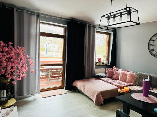 Posteľ alebo postele v izbe v ubytovaní Apartament SONIA