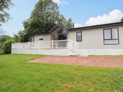 a house with a large yard in front of it at The Maples 44 in St Austell