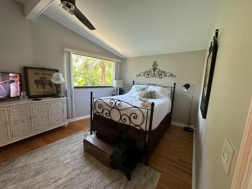 a bedroom with a bed and a window at Driftwood Dreams in Chapin