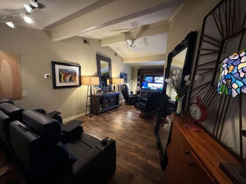 a living room with a couch and a mirror at Driftwood Dreams in Chapin