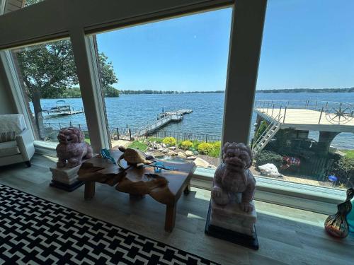 a living room with a view of the water at Driftwood Dreams in Chapin
