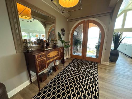 a room with a wooden dresser and a large door at Driftwood Dreams in Chapin