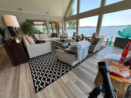 a living room with a view of the water at Driftwood Dreams in Chapin
