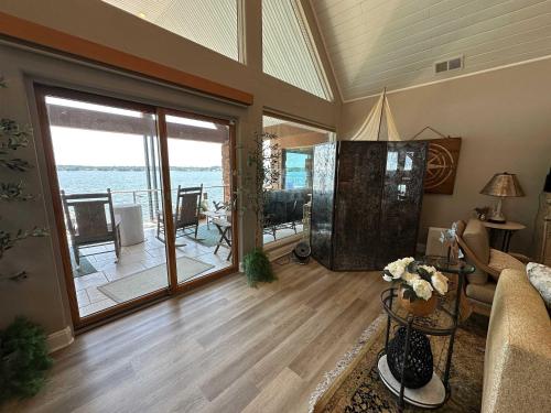 a living room with a view of the ocean at Driftwood Dreams in Chapin
