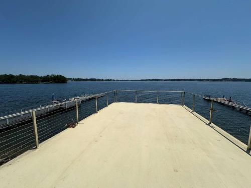 a dock on a large body of water at Driftwood Dreams in Chapin
