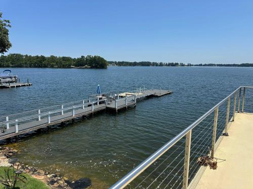 a dock on a large body of water at Driftwood Dreams in Chapin