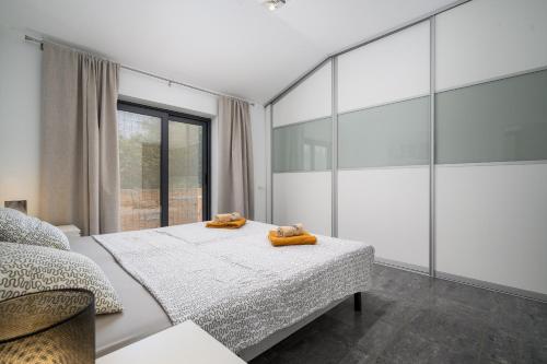 Postel nebo postele na pokoji v ubytování House Monique