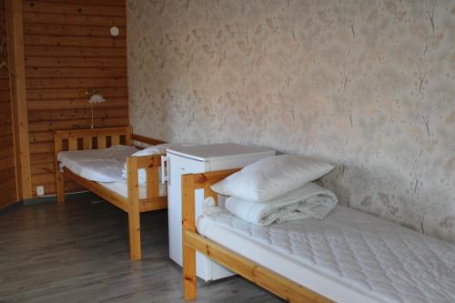 Ein Bett oder Betten in einem Zimmer der Unterkunft Fromhedens Camping