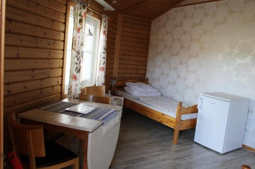 Ein Bett oder Betten in einem Zimmer der Unterkunft Fromhedens Camping