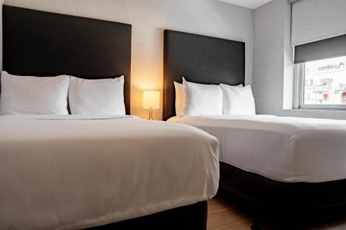 Katil atau katil-katil dalam bilik di Solita Soho Hotel