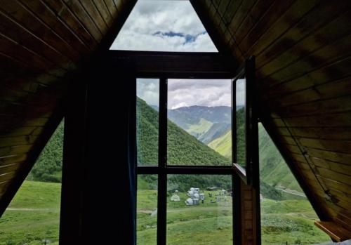 a window view of a mountain view from a cabin at Cottage Hillside in Juta in Jut'a