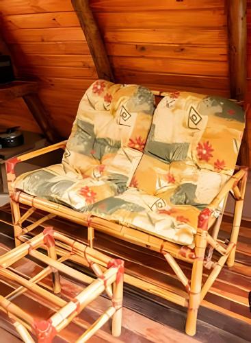 a bed sitting in the middle of a room at Espaço Gaia in Santana do Riacho