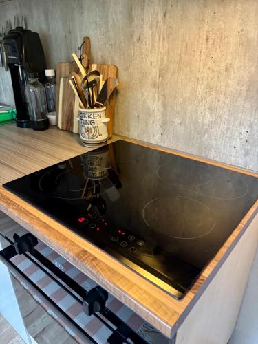 a kitchen counter with a stove top in a kitchen at Linda`s house in Grashopen
