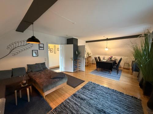 a living room with a couch and a table at Villa Komposch - adults only in Reifnitz