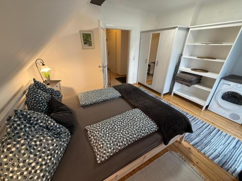 a living room with a couch and a washer at Villa Komposch - adults only in Reifnitz
