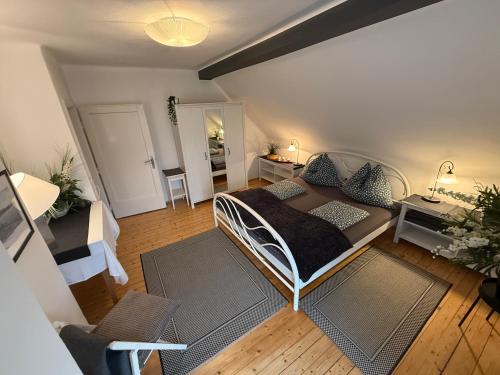 a bedroom with a bed and a living room at Villa Komposch - adults only in Reifnitz
