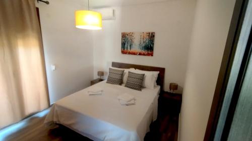 a small bedroom with a white bed in a room at Litinos Villas in Fodele